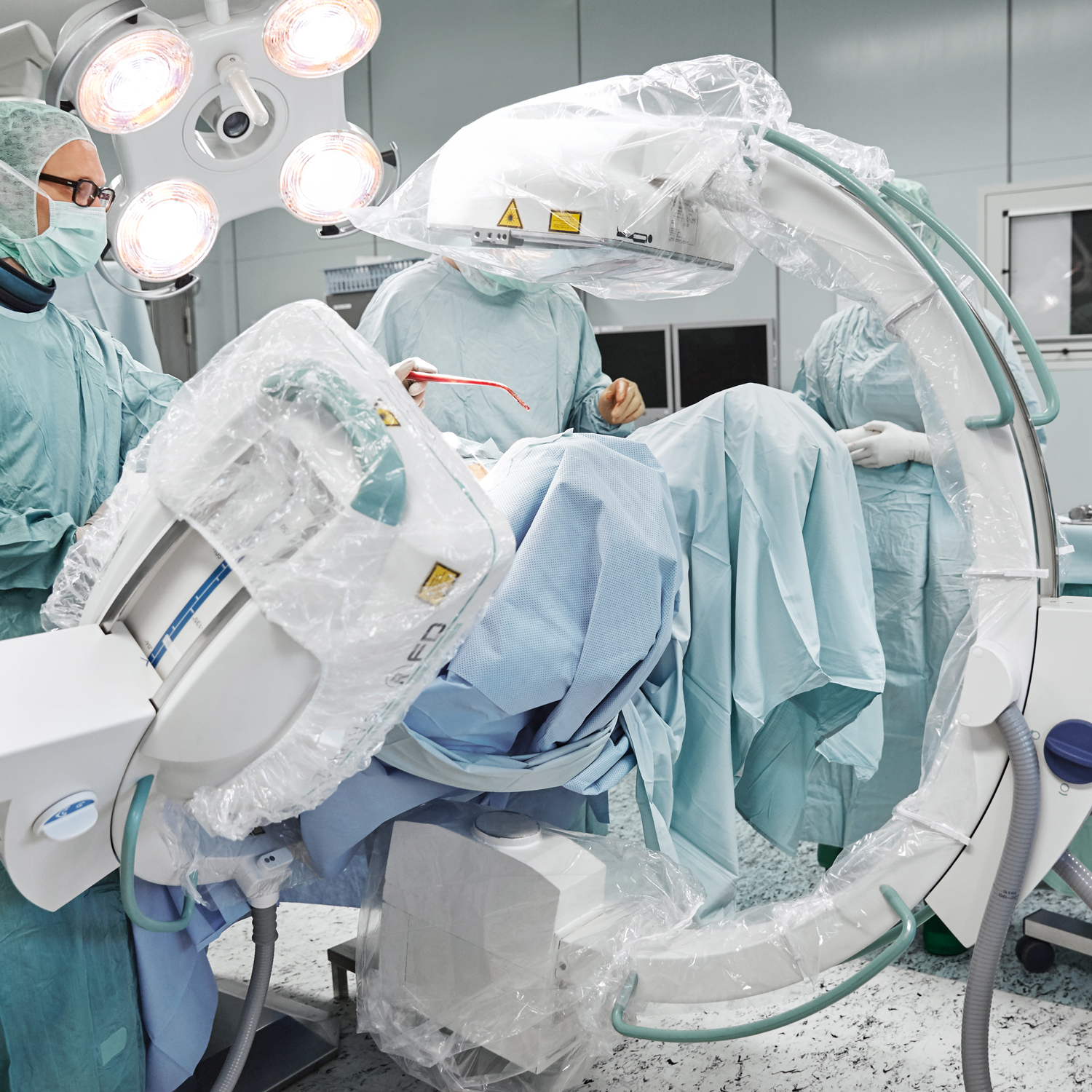Two Ziehm Flat panel C-arms imaging patient in operating theatre.